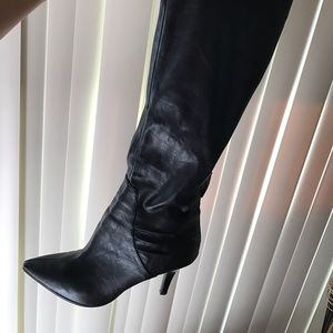 Tall black heeled boots