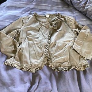 Canvas jacket with silk ruffles.