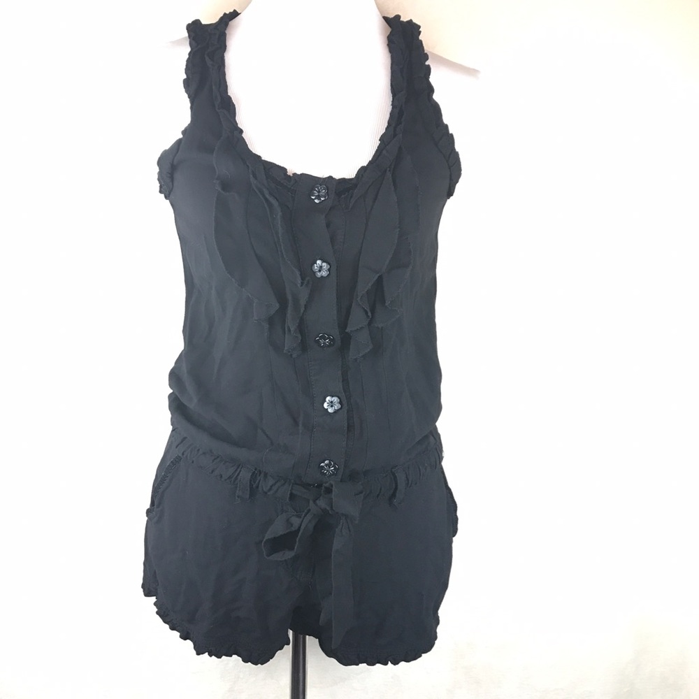 Jolt Romper black ruffles with flower buttons