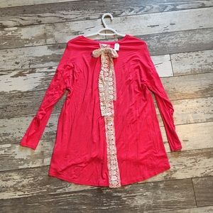 Pink top with lace bow detail