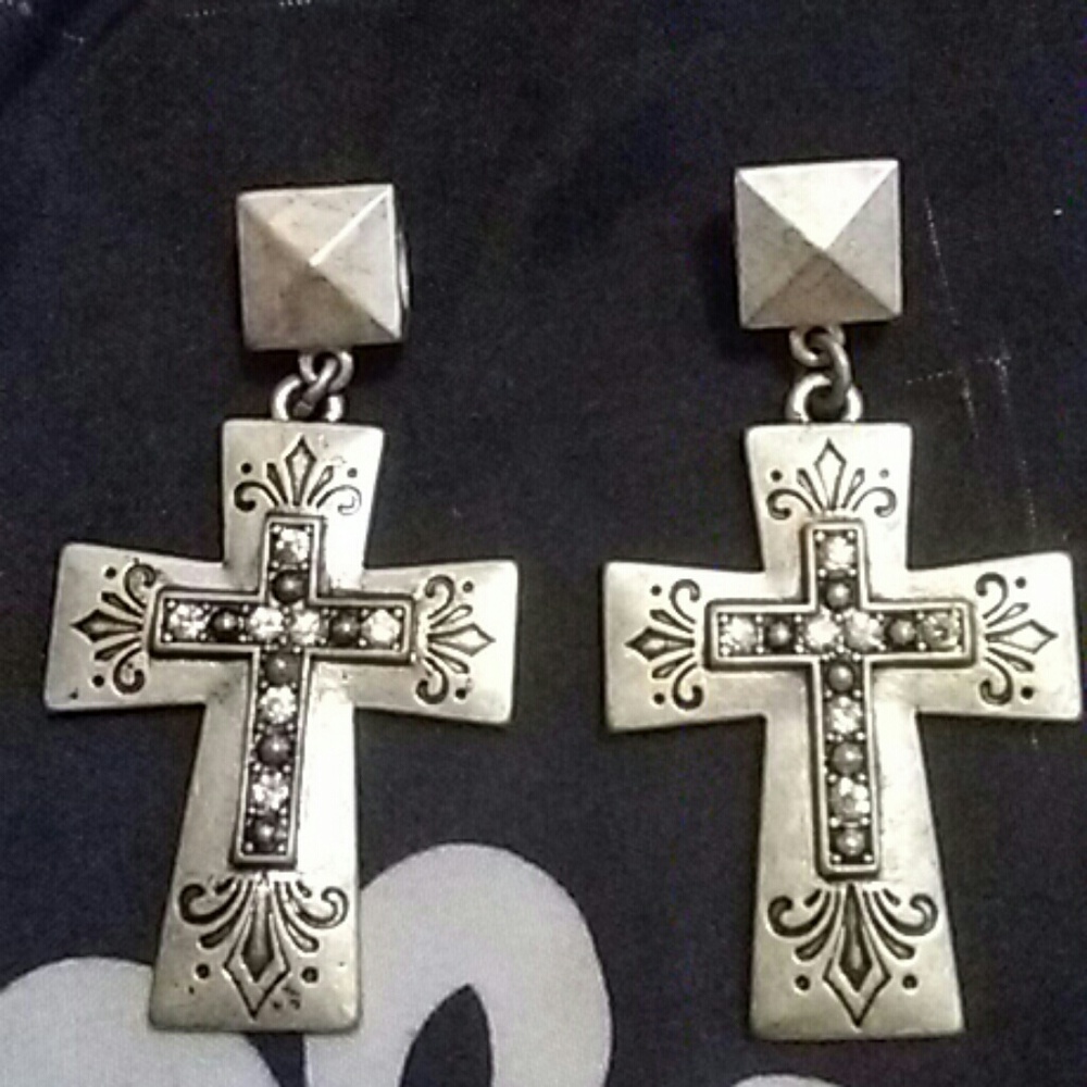 2 silver cross pendents with black and white cz