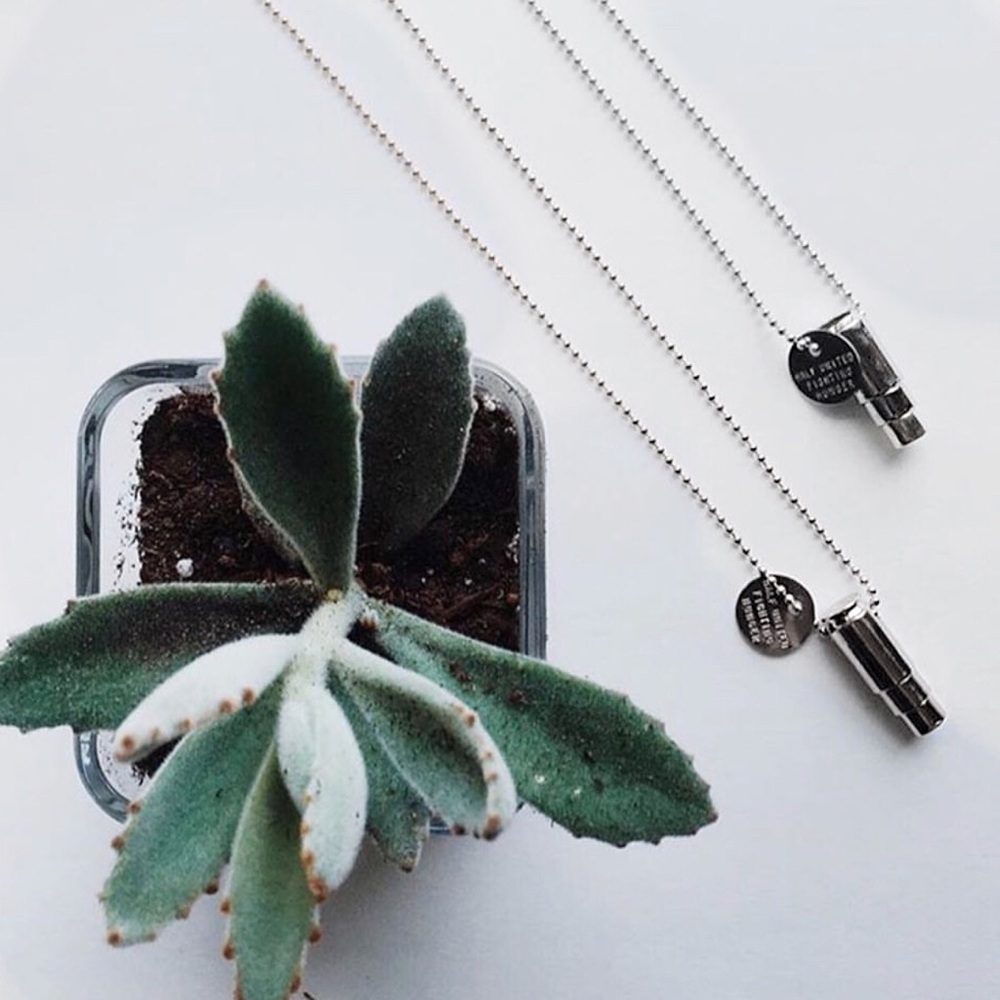 Silver Fighting Hunger Bullet Necklace - Picture 3 of 6