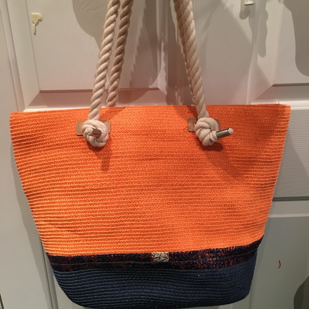 Orange and navy straw purse.
