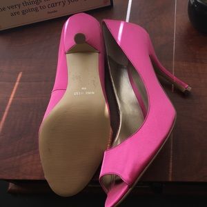 Hot pink satin peep toe pumps from Nine West