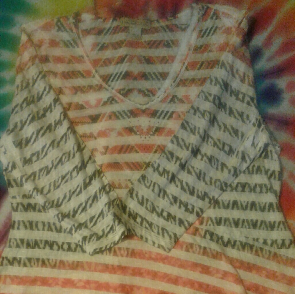 Aztec print shirt with handkerchief hem. New