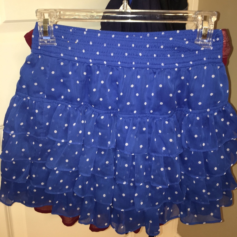 Blue Hollister ruffled skirt with white polka dots