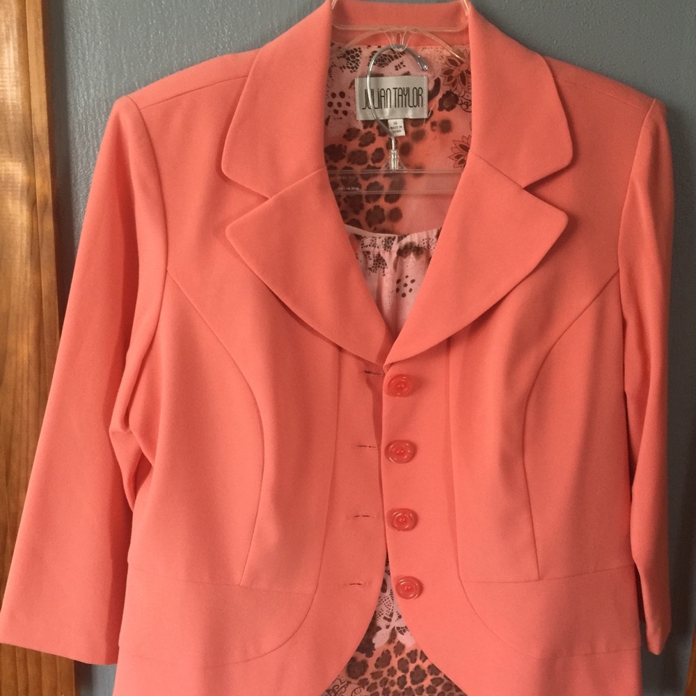 Two piece jacket & skirt outfit.