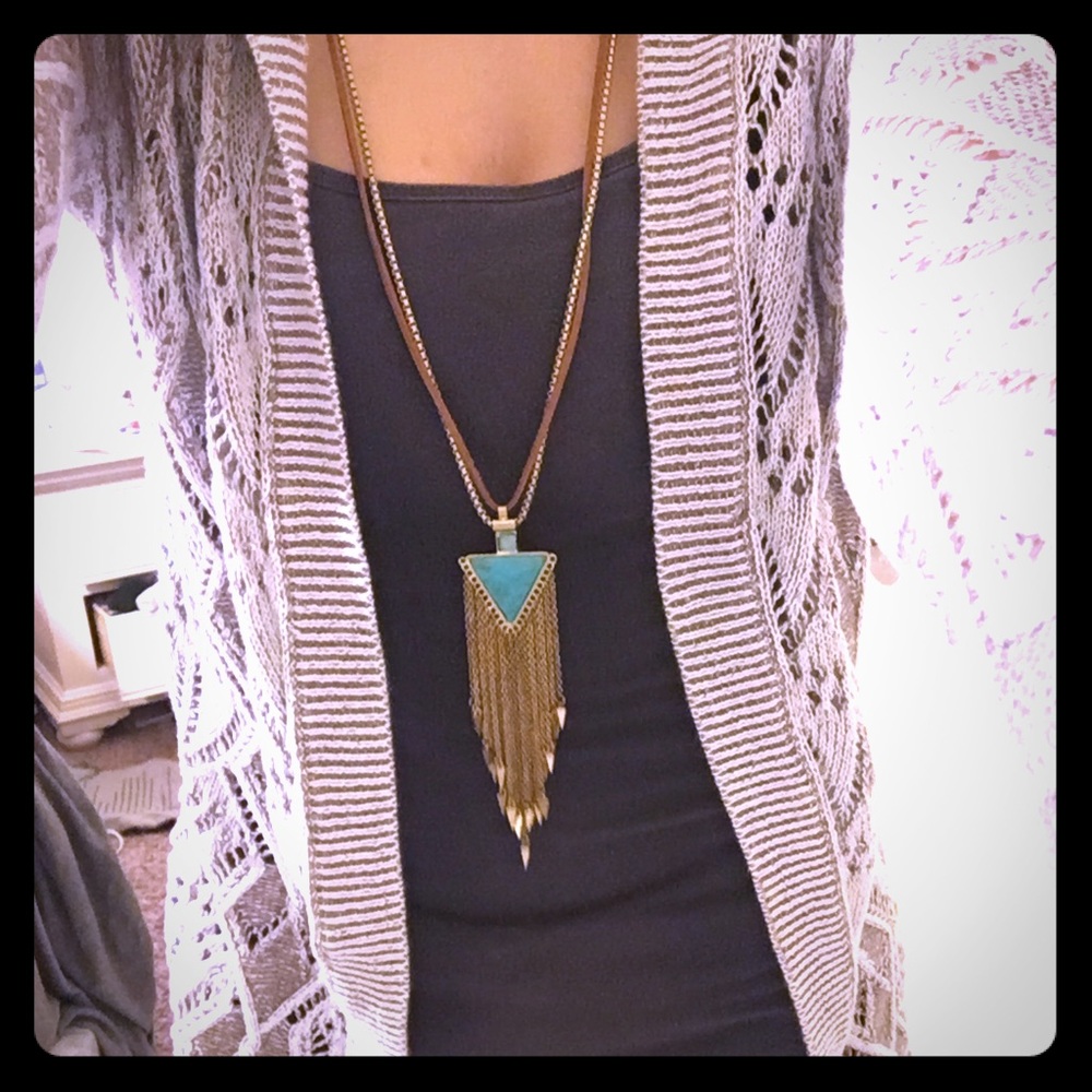 White and beige colored cardigan