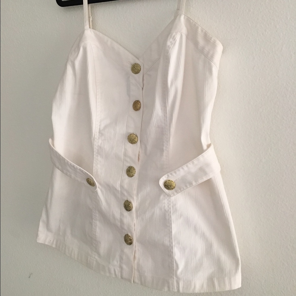 White top with decorative buttons