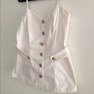 White top with decorative buttons