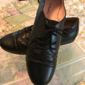 Flat leather oxfords.