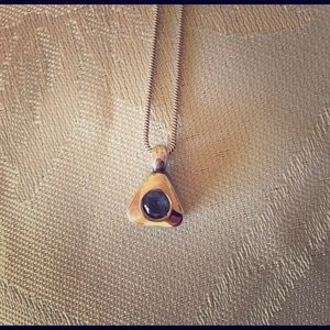 Silver, gold, and aquamarine charm necklace