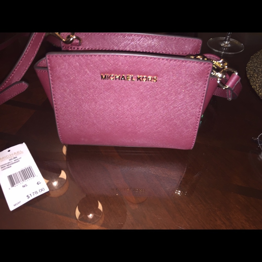 Micheal Kors burgundy over the shoulder bag