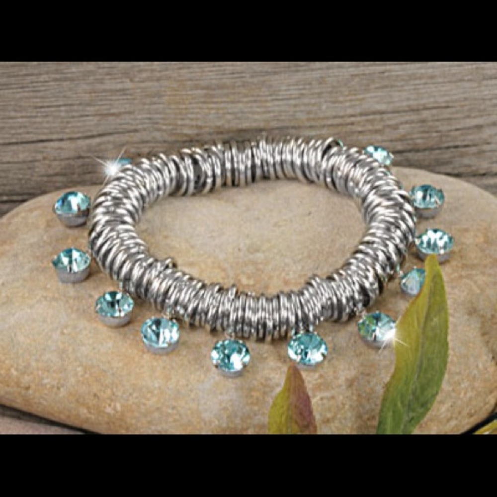 REDUCED polished  Silvertone rings Aqua crystals.
