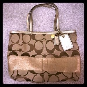 Tan Signature Coach Purse with Gold Accent