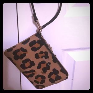 Coach corner zip wrislet is ocelot print