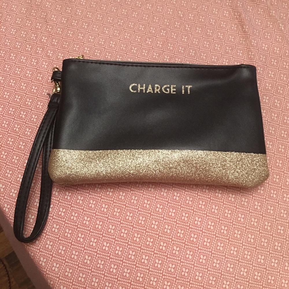 Black wristlet with charger built inside