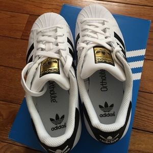 Brand new adidas superstar sneakers