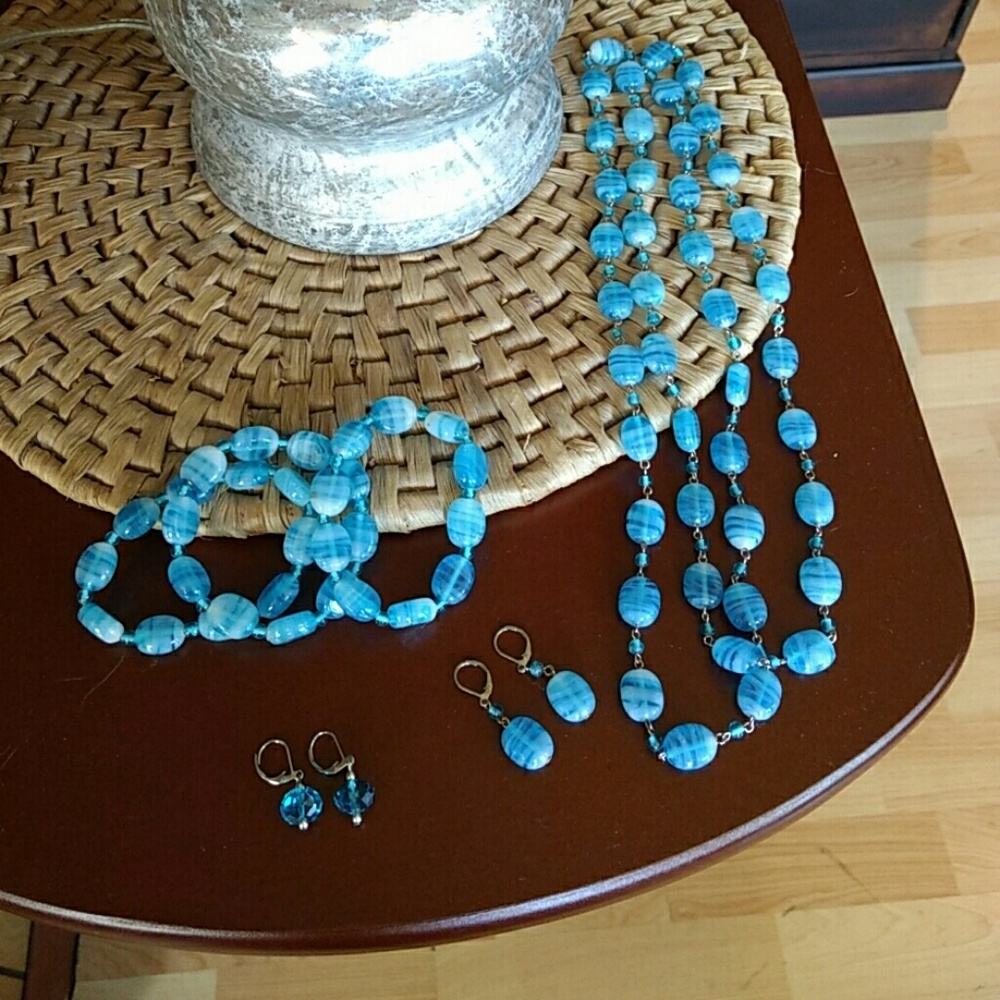 Necklace, bracelets and two sets on earrings
