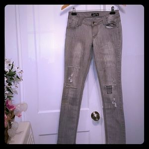 Grey wash moto inspired patch skinny jeans