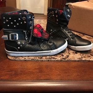 Black red shoes studded with chains.