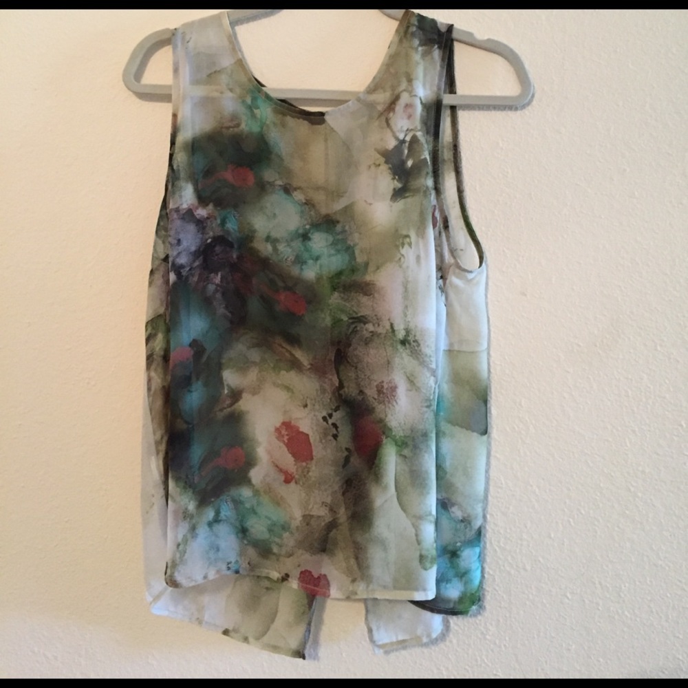 Multi-colored sheer sleeveless blouse tied back