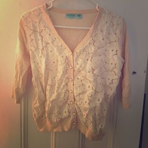 Sweater with lace and "pearl" buttons.