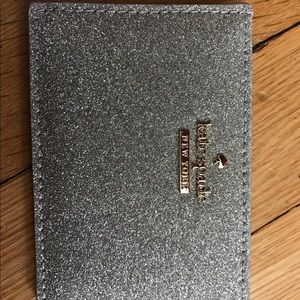 Authentic new Kate Spade bus. card holder silver