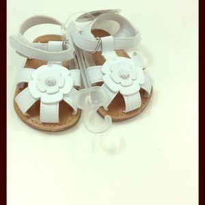 White and brown baby sandals