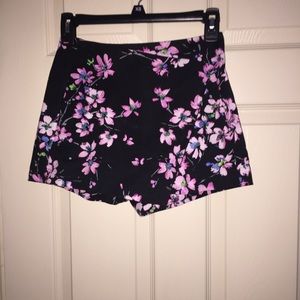 Shorts with skirt overlay