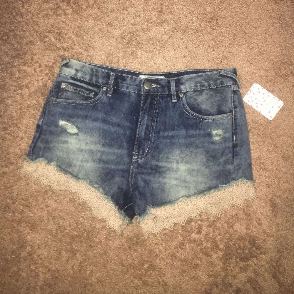 Free people jean shorts with lace trim