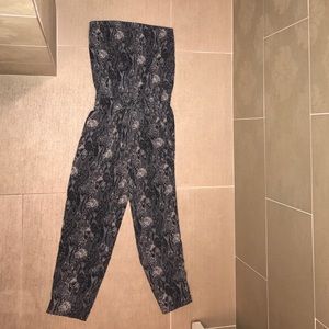 Strapless full length jump suit. Snake skin print