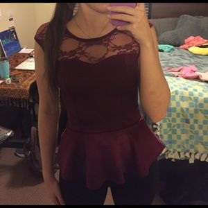 Maroon peplum top.