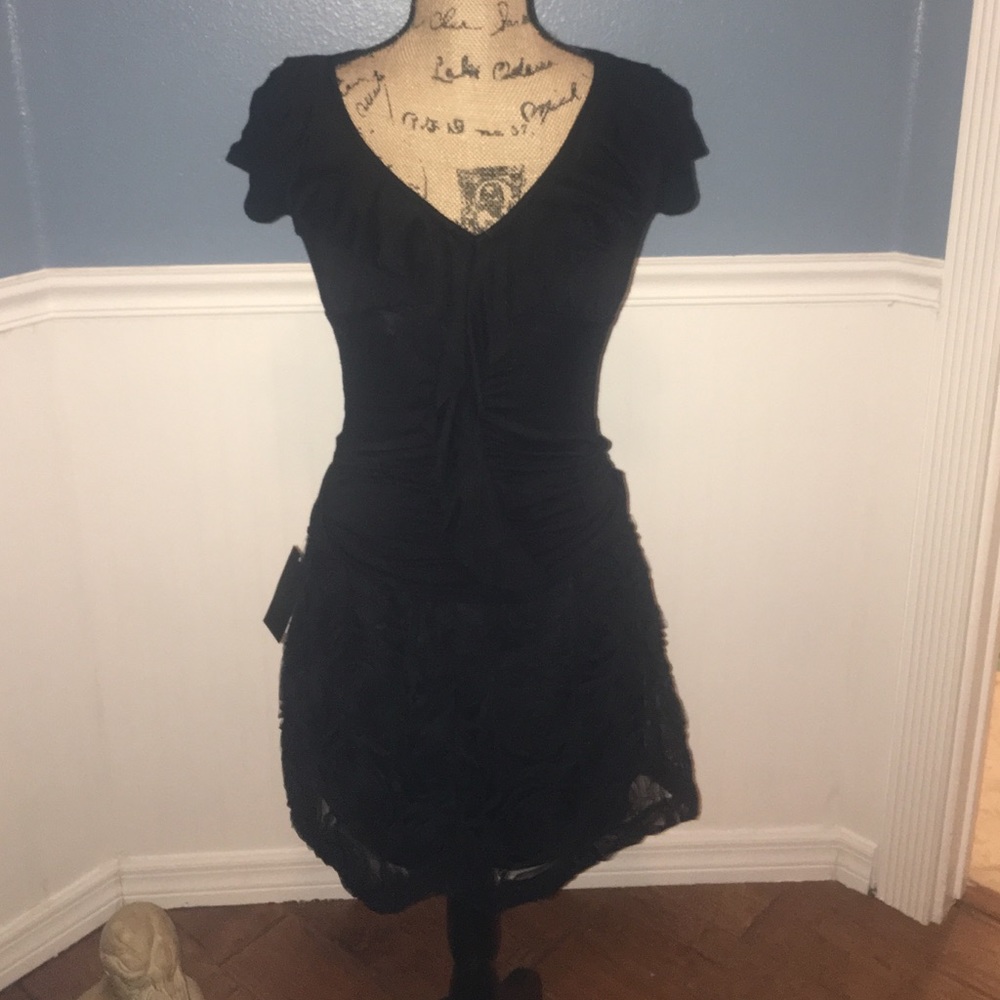 Brand new Black lacy mini skirt with black V nk