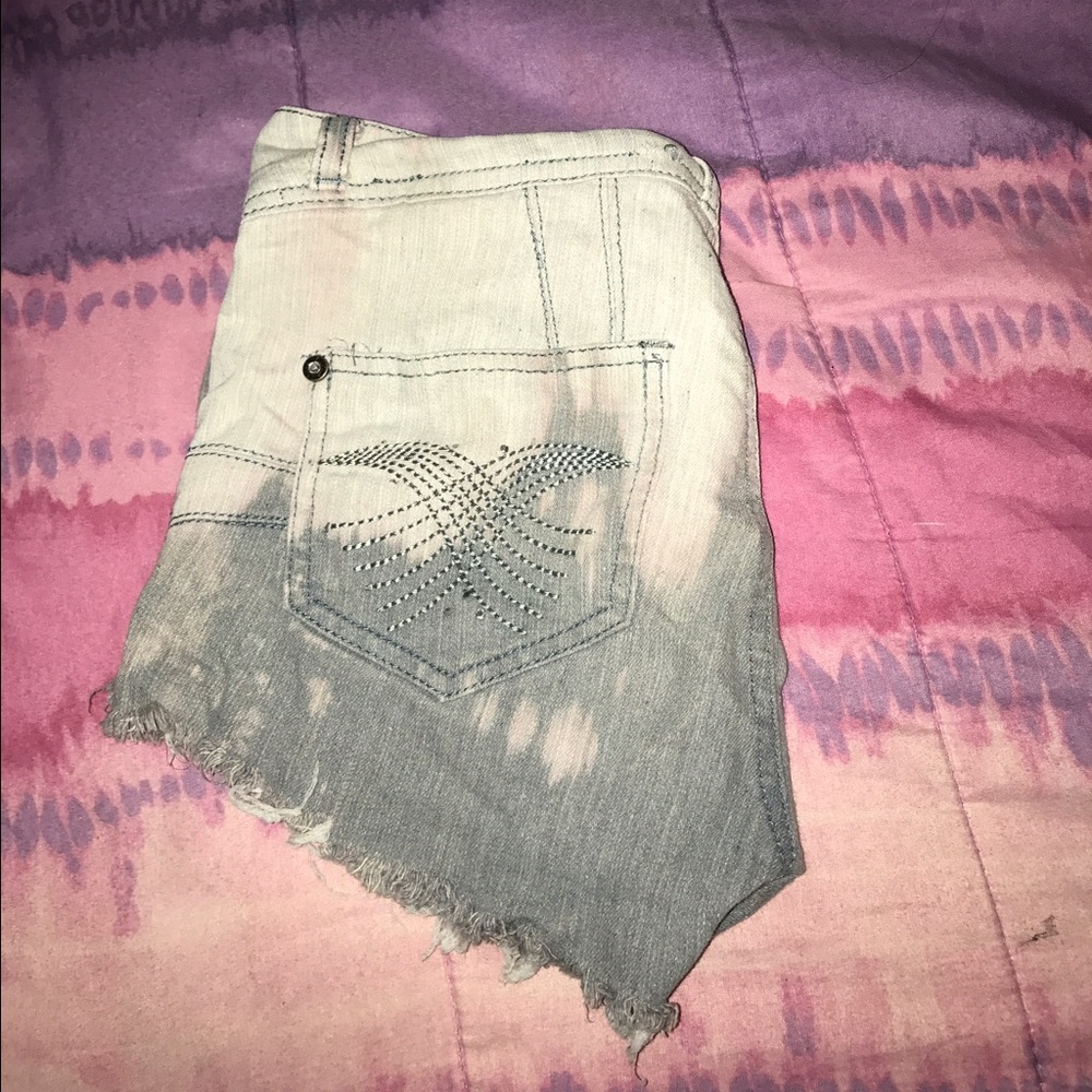 Semi high waisted Bleached and distressed shorts
