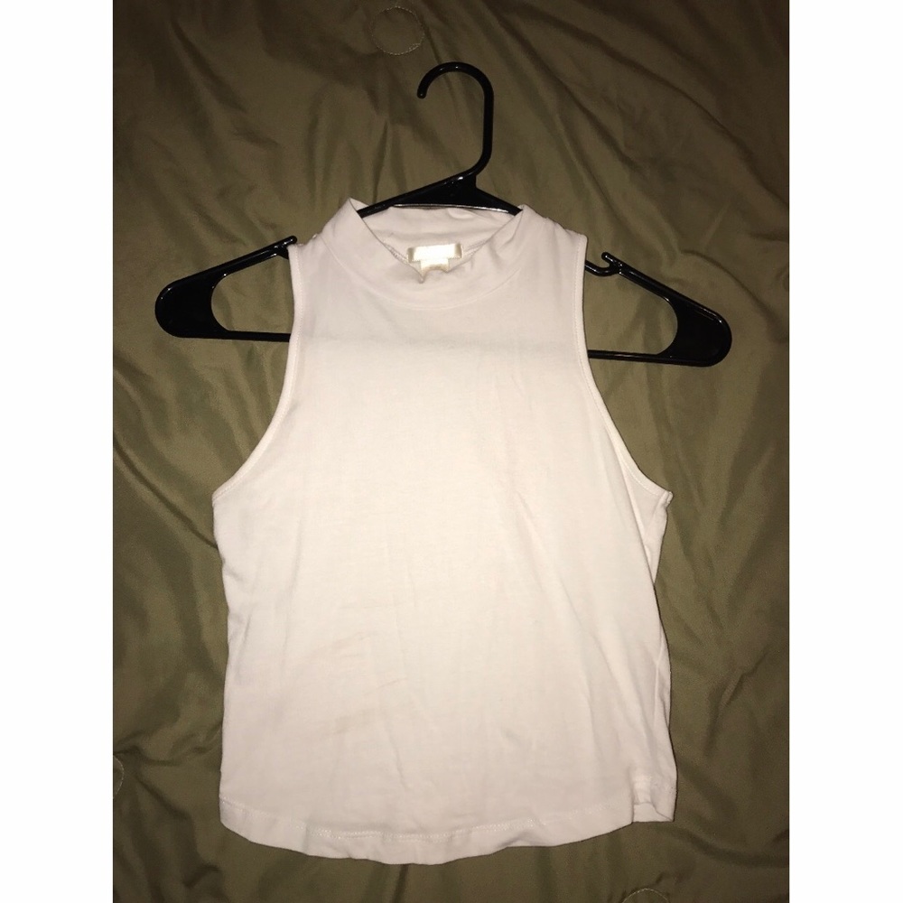 All white mock neck crop top.