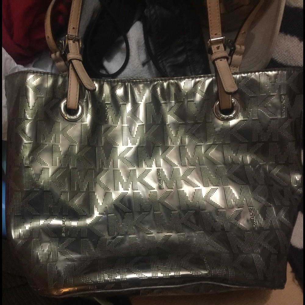 Metallic monogram micheal kors jet set tote.