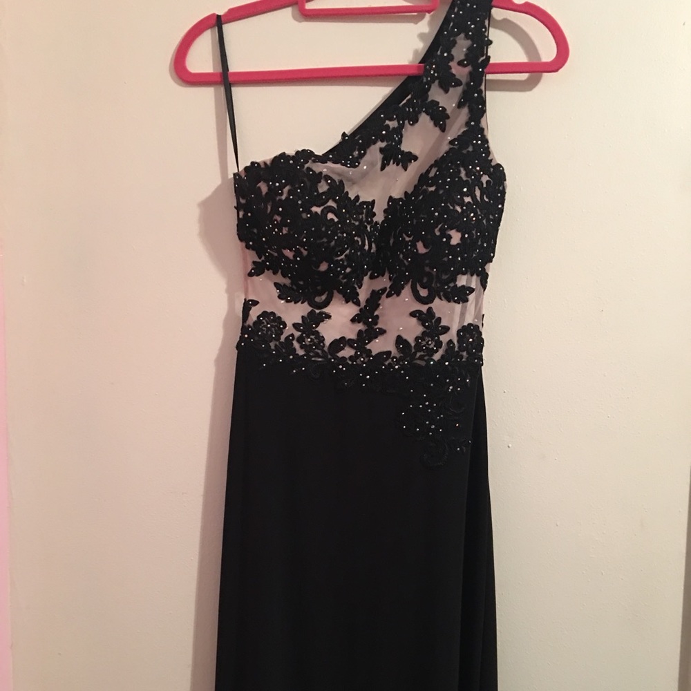 Black and sparkly gown .
