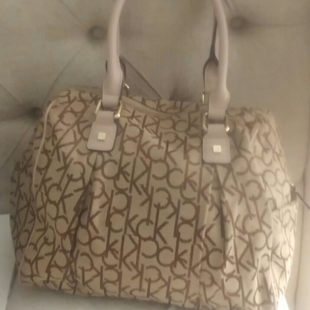 Tan ck bag with light pink handle