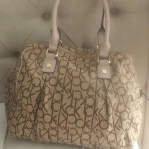 Tan ck bag with light pink handle