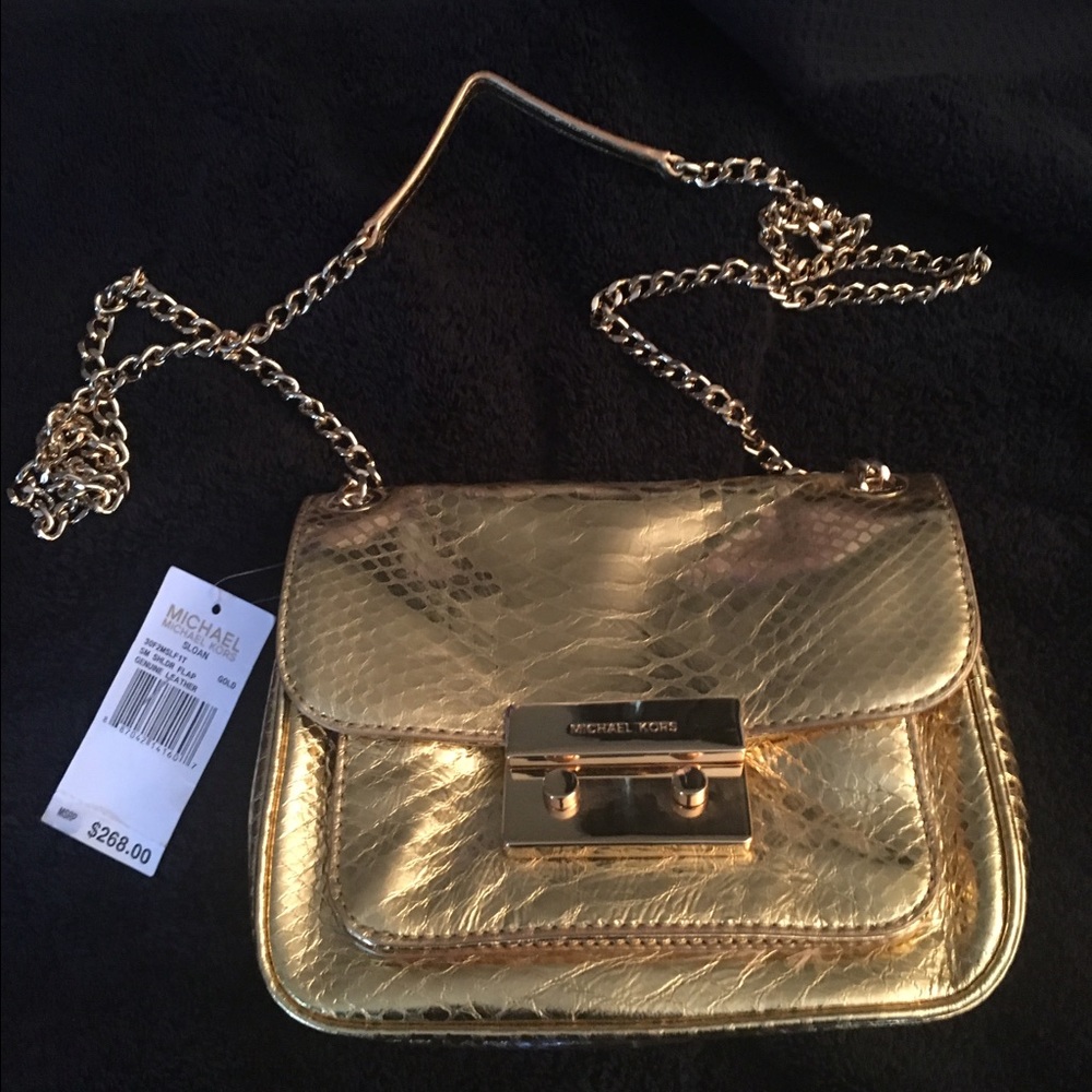 Michael Kors gold cross body bag.  NWT