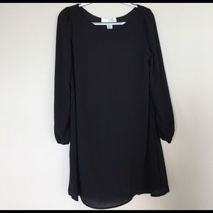 Black flowing knee length long sleeve dress