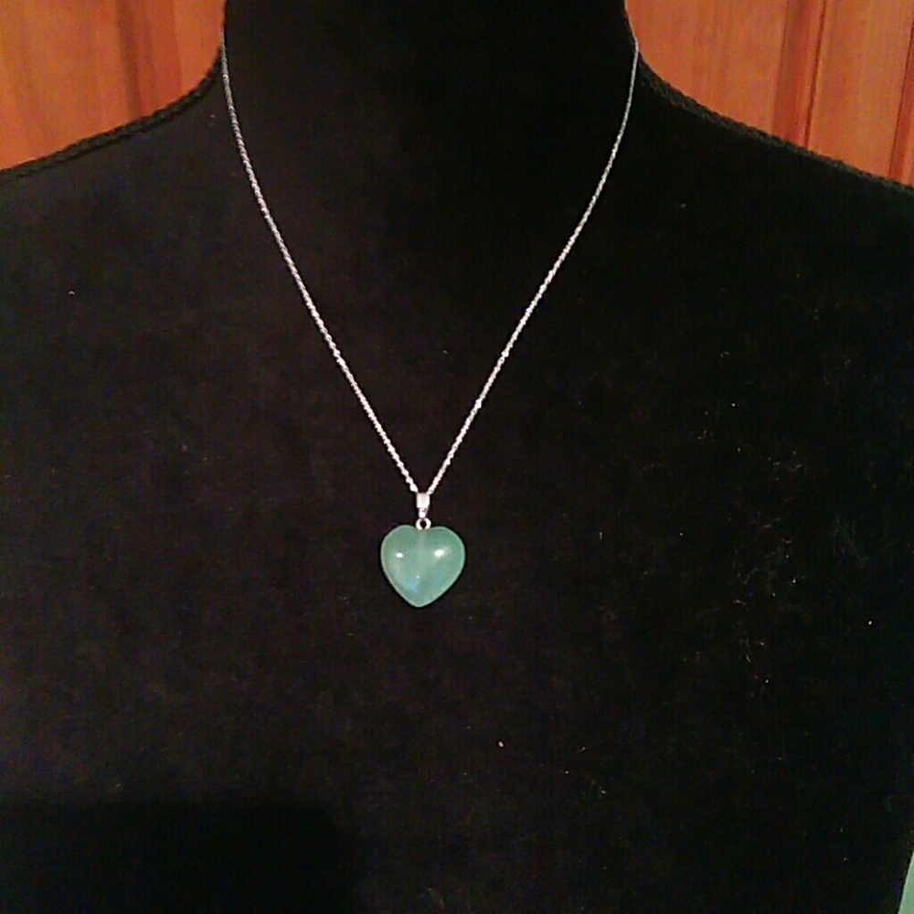 Sterling silver chain and genuine Jade pendant.