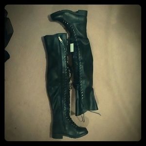 Black tie over the knee boots