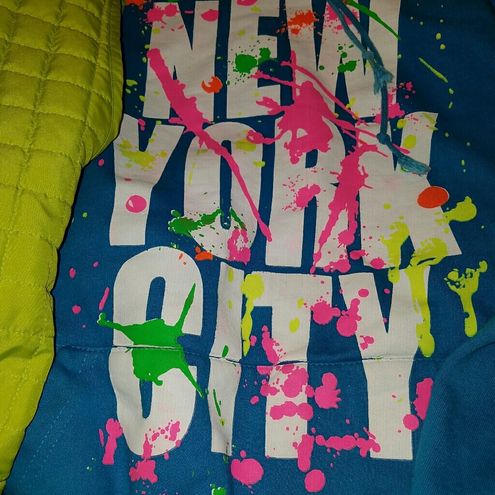 Royal blue hoodie and lime green vest.