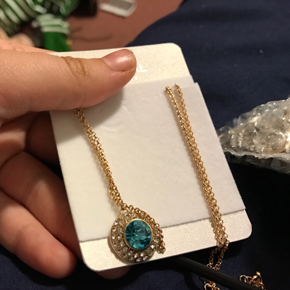 Large blue gemstone necklace with golden chain