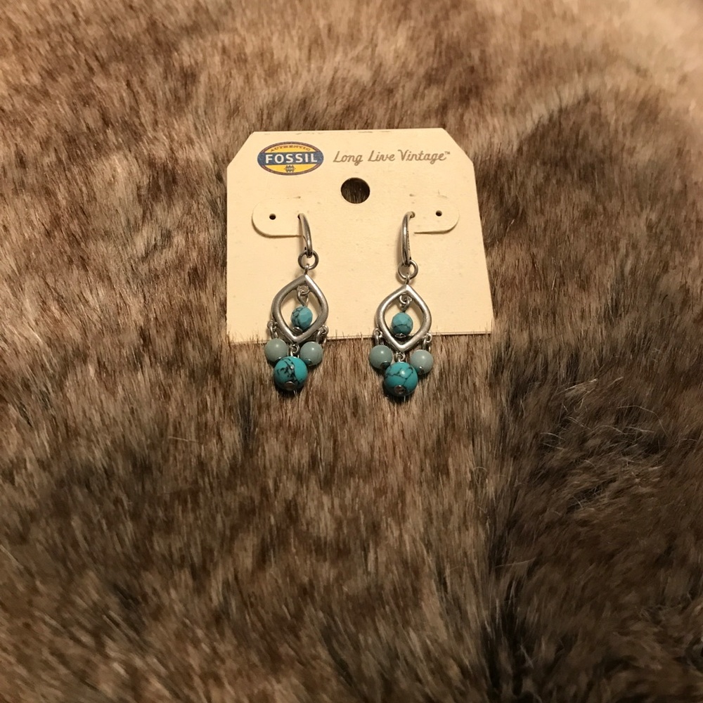 Silver dangle earrings with blue stones