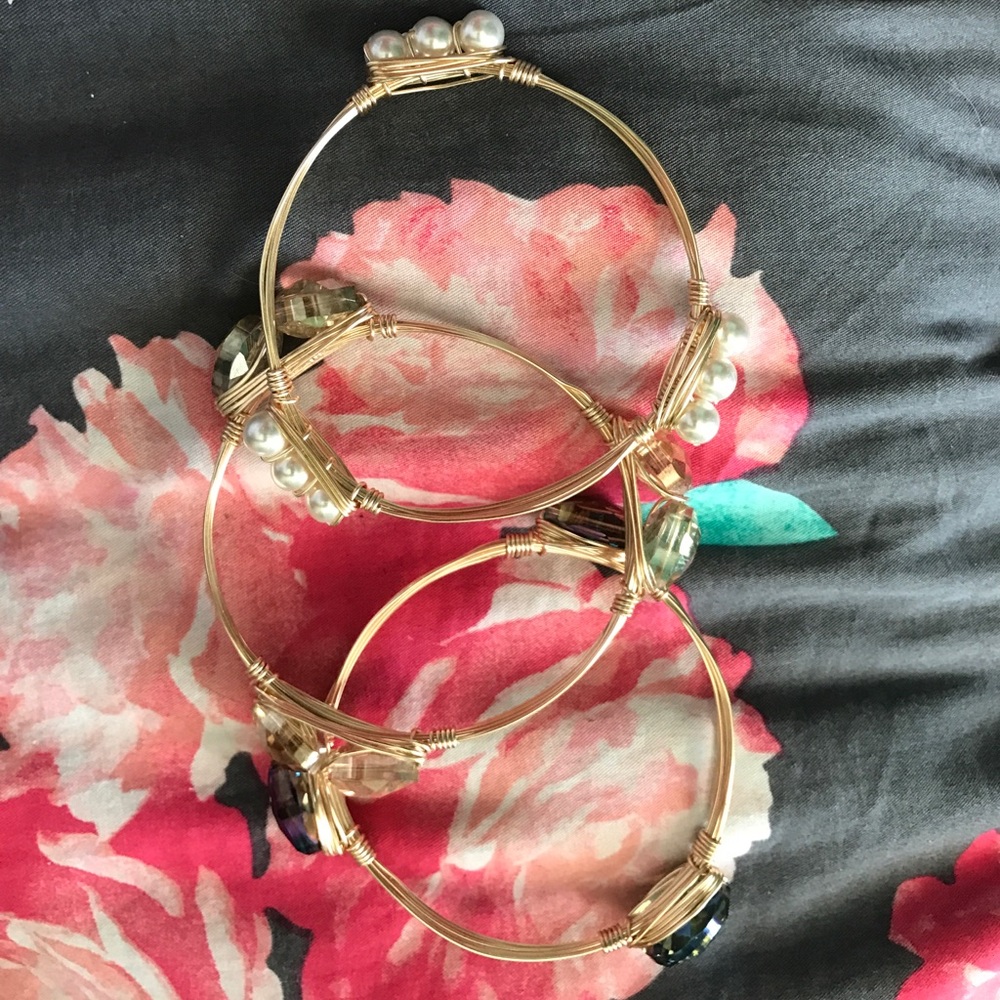 Three gold bangles 1 with pearls, 2 are gems