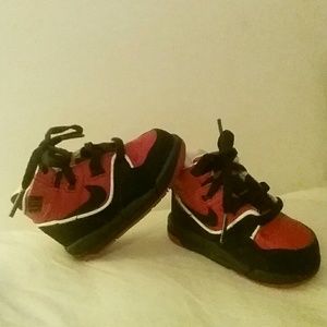 Red and black size 3c baby hightop Nike sneakers