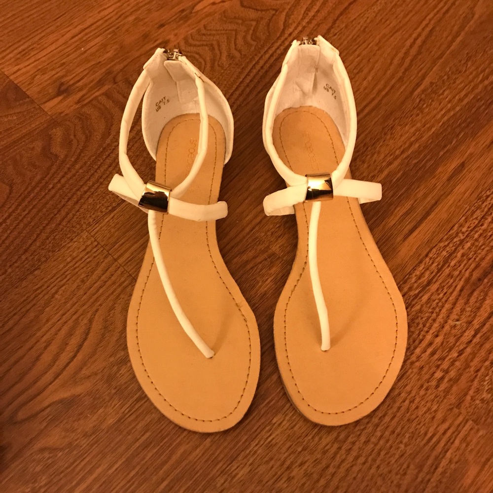 White sandals with gold accent